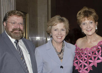 Group of three professionals smiling