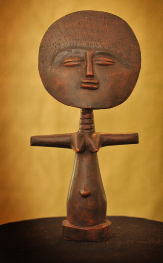 African bronze sculpture of woman with her arms outreached