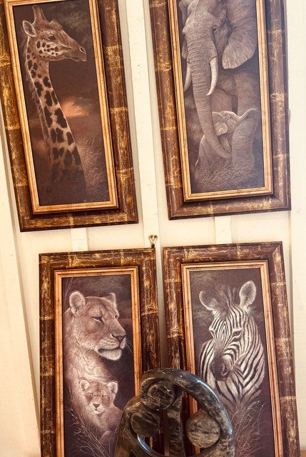 Four detailed paintings of African animals - giraffe, elephant, lion and zebra. 