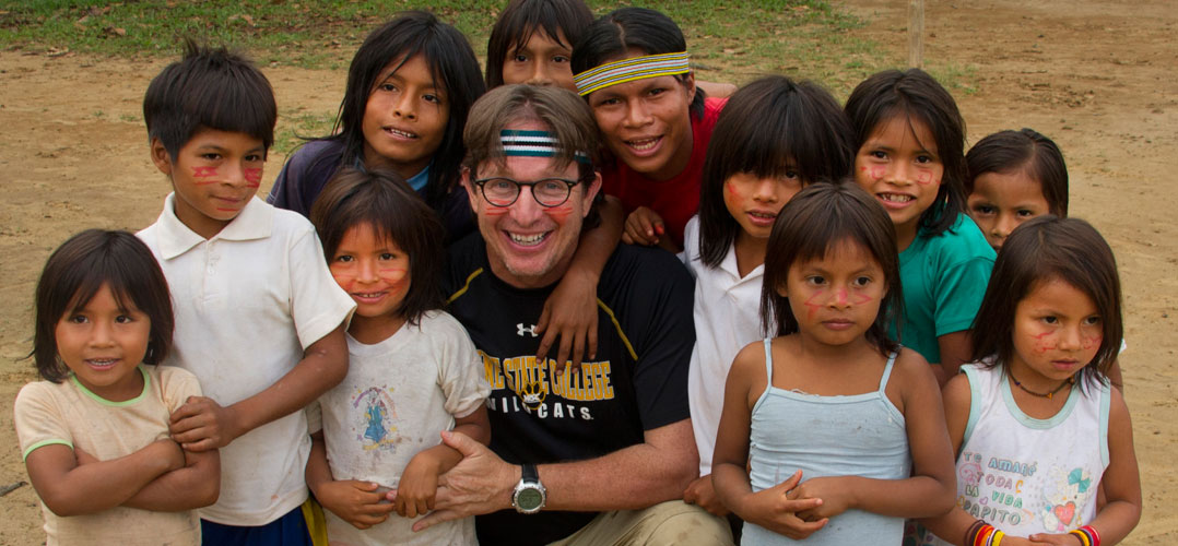 Dean Jacobs with group of children from the Amazon rain forest