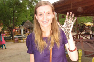 Student showing her henna decorated hand