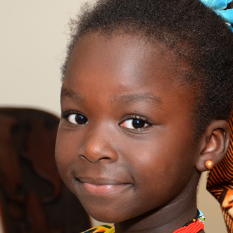 Young African girl smiling at the camera