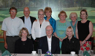 Ten people grouped together