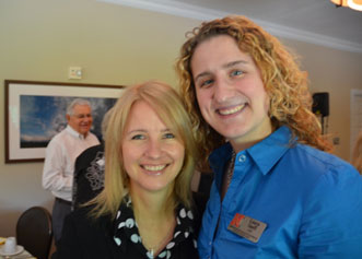 Two woman posing together and smiling
