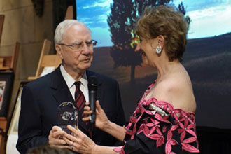 Ken Morrison receiving an award from Natalie Hahn