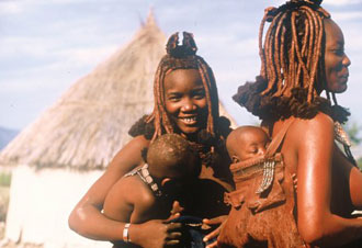 Two young African women carrying infants